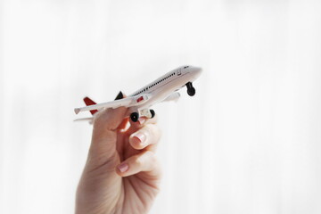 hand holding a plane