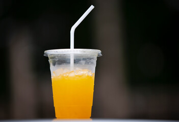 glass of orange juice on a dark background