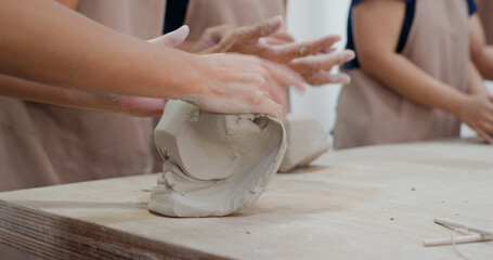 Kneading clay material before making pottery