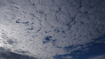 Blue sky background with clouds during sunrise