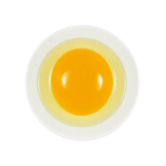 Fresh liquid raw egg, white and yolk, in white ceramic bowl isolated on white background top view     