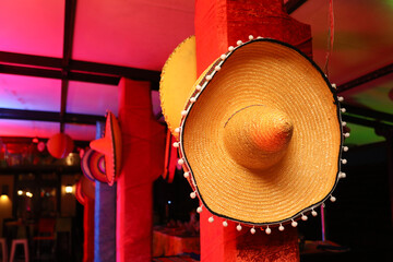 Mexican sombrero hanging on a pilar for an event. 