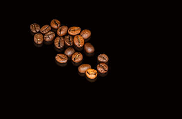 Coffee beans on the black background