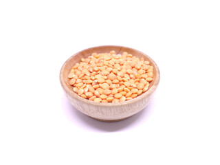 Red Lentils or Masoor Dal in a bowl isolated on White Background. Red lentils rich source of fiber and protein. Healthy food concept.