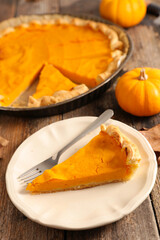 pumpin pie on wood background