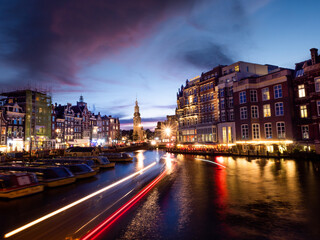 Fototapeta na wymiar Light trails in a Canal of Amsterdam