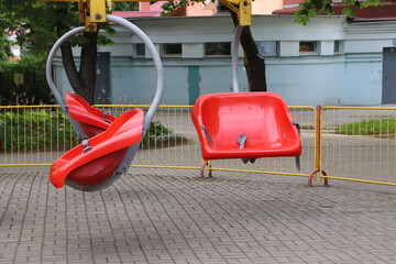 red plastic seat of speedy carousel