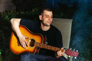 Obraz premium man plays the guitar.