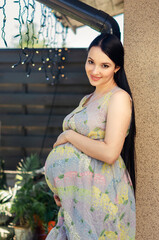 Pregnant woman in white dress