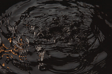 Black and faded water vibrating with the wind