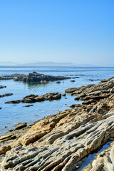 rocky maritime landscape with blue sea and clear sky