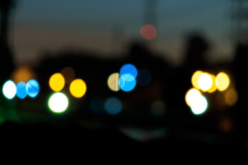 Bokeh light and blur of city skyline during twilight.