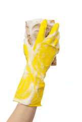 Hand in yellow rubber glove soap foam brown sponge white background