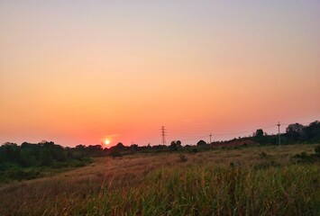 Fototapeta premium sunset over the field
