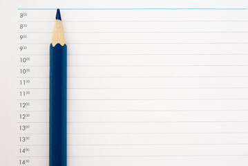 .sharp dark blue pencil on a sheet of schedule