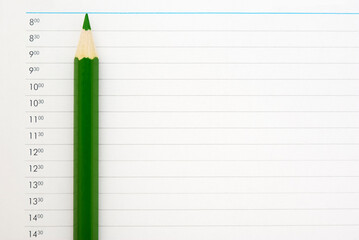 Green pencil on the schedule page