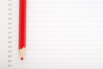 Blunt red pencil on the schedule page