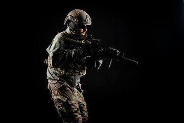 special forces attack, soldier in uniform with a rifle in action, american ranger with guns