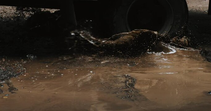 Car driving on  impassibility of roads. A lot of mud
