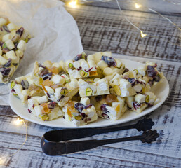 white chocolate fudge with pistachio, cashews, marmalade and dried cranberries