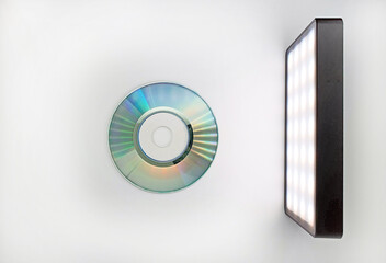 Mini-CD (CD3) on a white background is illuminated by an led illuminator