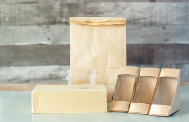 Food container takeout for delivery, for example (paper bag, box, glass, plastic) used for the background.