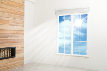 Beautiful view on blue sky with clouds through window in room