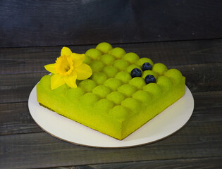 Square Chocolate velvet cake with daffodil and blueberries
