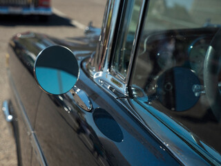 Driver's side and mirror on an antique classic car