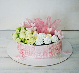 pink stencil cake with roses and merengue for anniversary