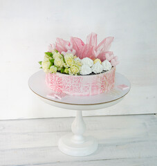 pink stencil cake with roses and merengue for anniversary