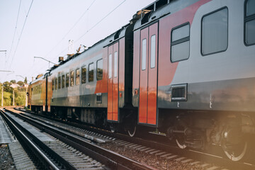 Passenger electric train moving on the railway.