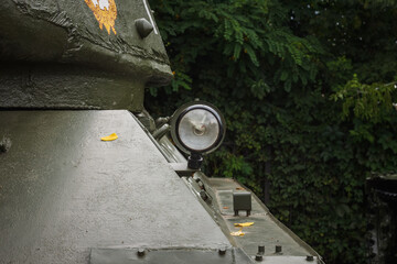 Headlight of heavy tank. Design elements and details of the old Soviet tank. Military green...