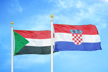 Sudan and Croatia two flags on flagpoles and blue sky