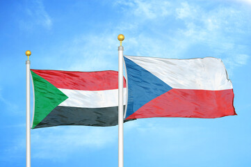 Sudan and Czech Republic two flags on flagpoles and blue sky