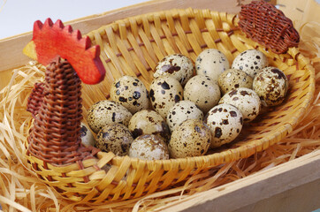 Quail eggs in a wicker basket.