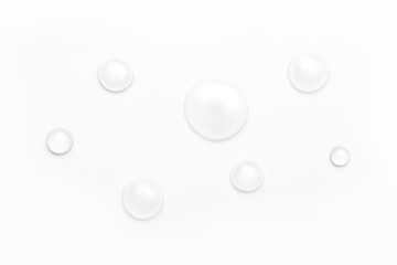 drops of water on a white background, top view