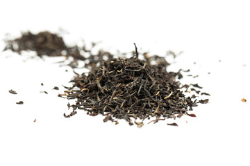 Leaves of black premium dry tea on a white background