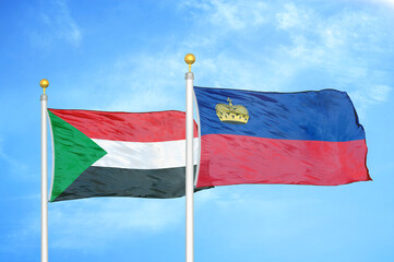 Sudan and Liechtenstein two flags on flagpoles and blue sky