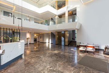 Interior of a luxury hotel lobby with marble floor,reception counter