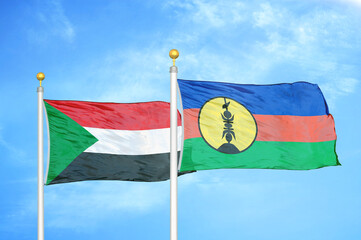 Sudan and New Caledonia two flags on flagpoles and blue sky