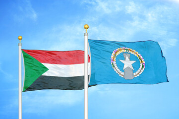 Sudan and Northern Mariana Islands two flags on flagpoles and blue sky