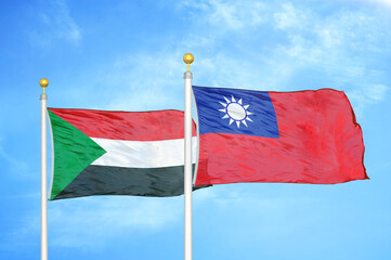 Sudan and Taiwan two flags on flagpoles and blue sky