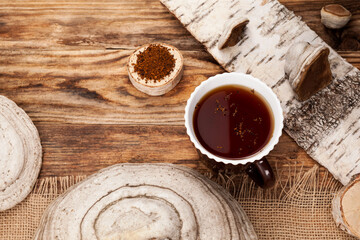 Chaga tea is a healthy natural drink. Natural antioxidant. Prepared from dried Chaga birch mushroom. Used in alternative medicine and herbal medicine. View from above