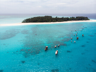 Aerial view of Mnemba Atoll in Zanzibar - The Famous Spot for Snorkeling and Boat Tour