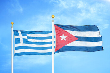 Greece and Cuba two flags on flagpoles and blue sky