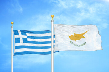 Greece and Cyprus two flags on flagpoles and blue sky