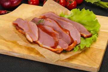 Sliced smoked duck breast served salad