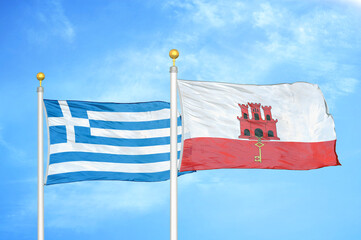 Greece and Gibraltar two flags on flagpoles and blue sky