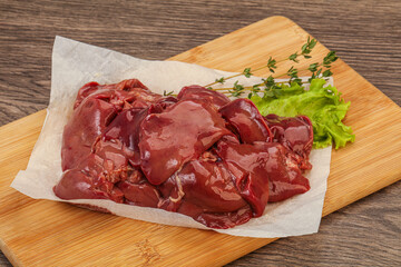 Raw chicken liver over board